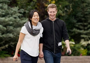 Facebook CEO Zuckerberg walks with wife Priscilla Chan at the annual Allen and Co. conference at the Sun Valley
